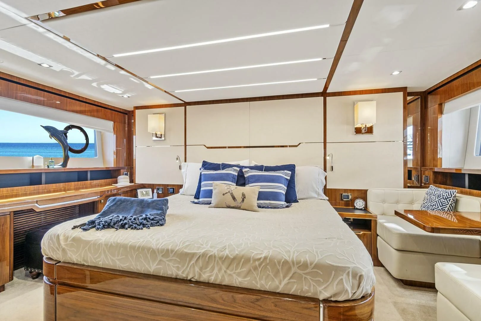 a bedroom with a bed and a couch aboard ONCE AROUND Yacht for Sale