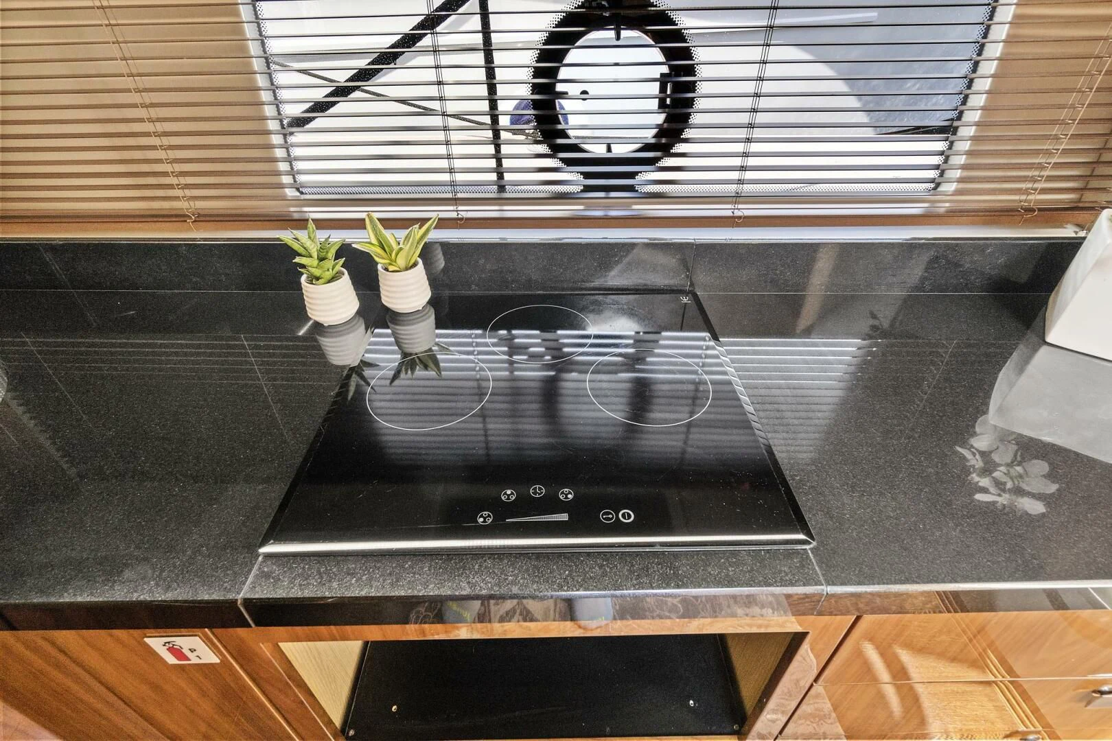 a black machine with a plant in it aboard ONCE AROUND Yacht for Sale