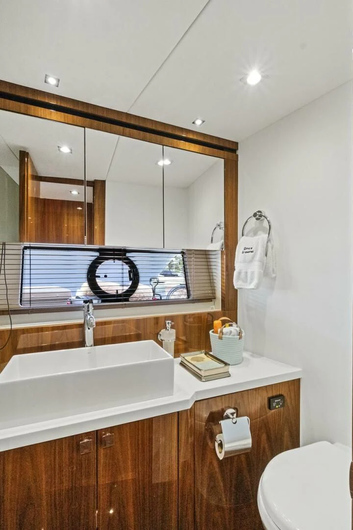 a bathroom with a large mirror aboard ONCE AROUND Yacht for Sale