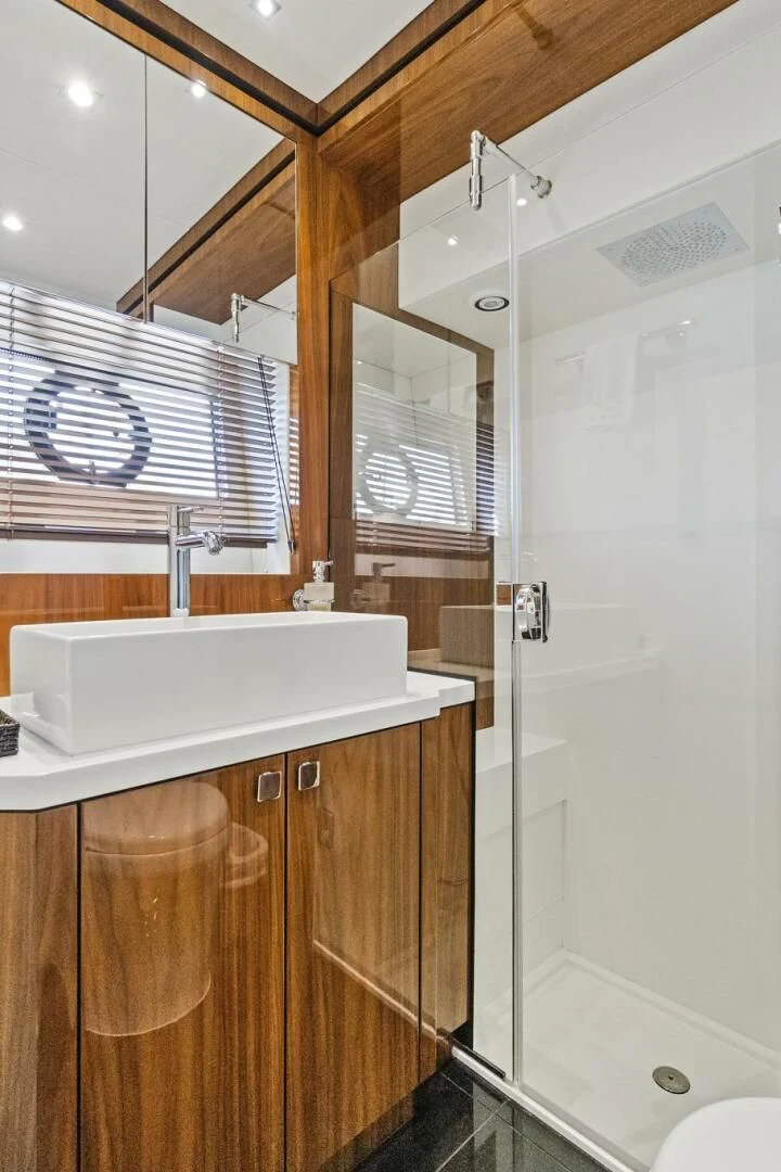 a bathroom with a sink and a shower aboard ONCE AROUND Yacht for Sale