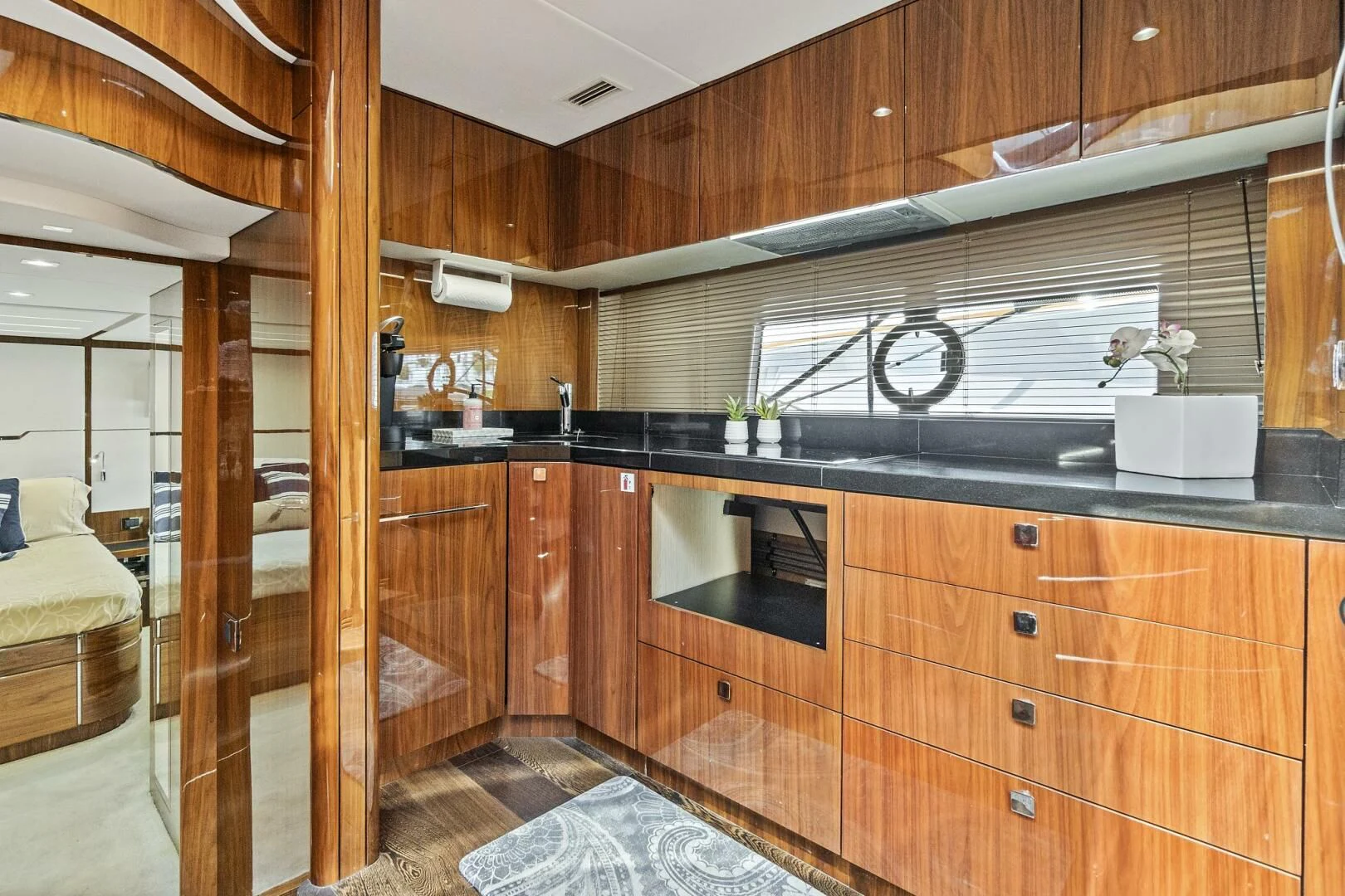 a kitchen with wooden cabinets aboard ONCE AROUND Yacht for Sale