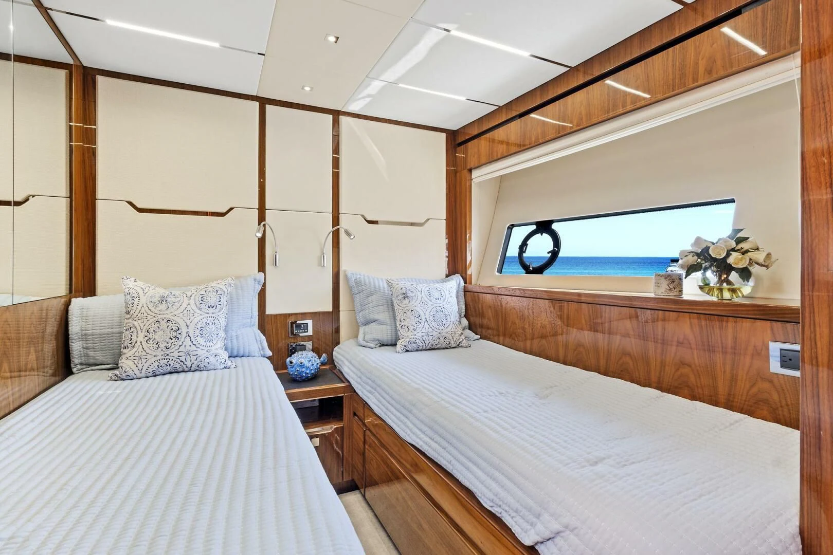 a bedroom with a bed and a mirror aboard ONCE AROUND Yacht for Sale