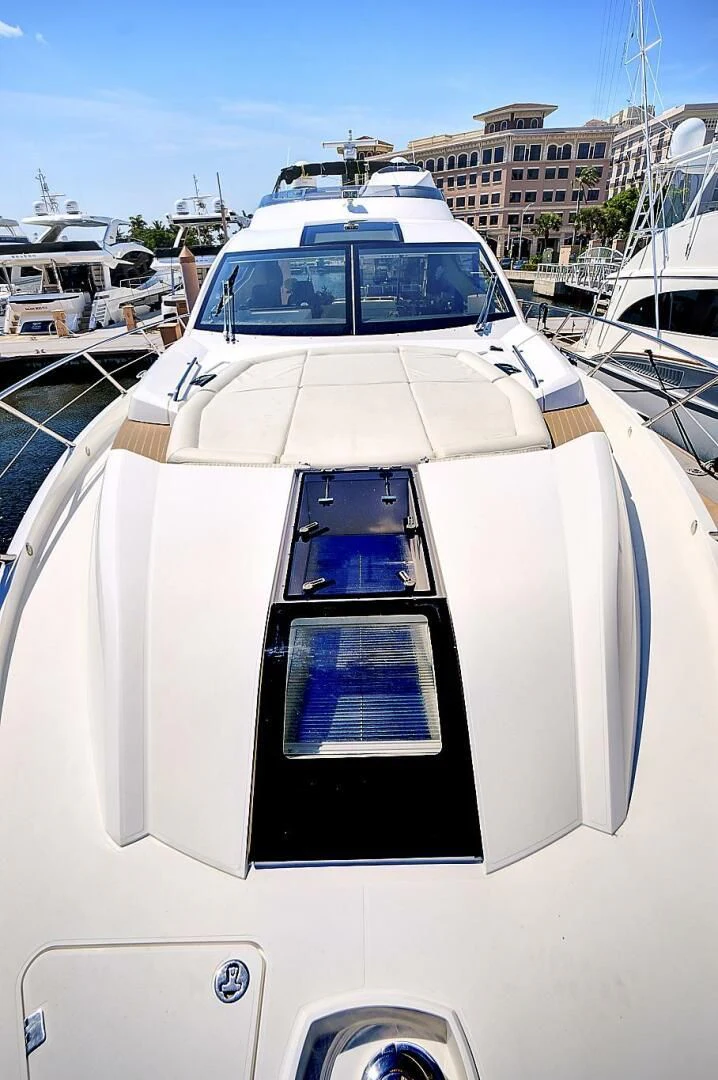 a white car on a boat aboard ONCE AROUND Yacht for Sale