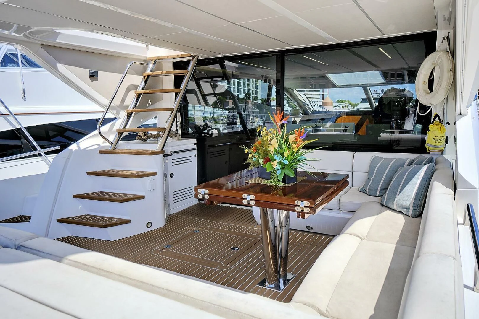 inside of a vehicle with a table and a couch aboard ONCE AROUND Yacht for Sale
