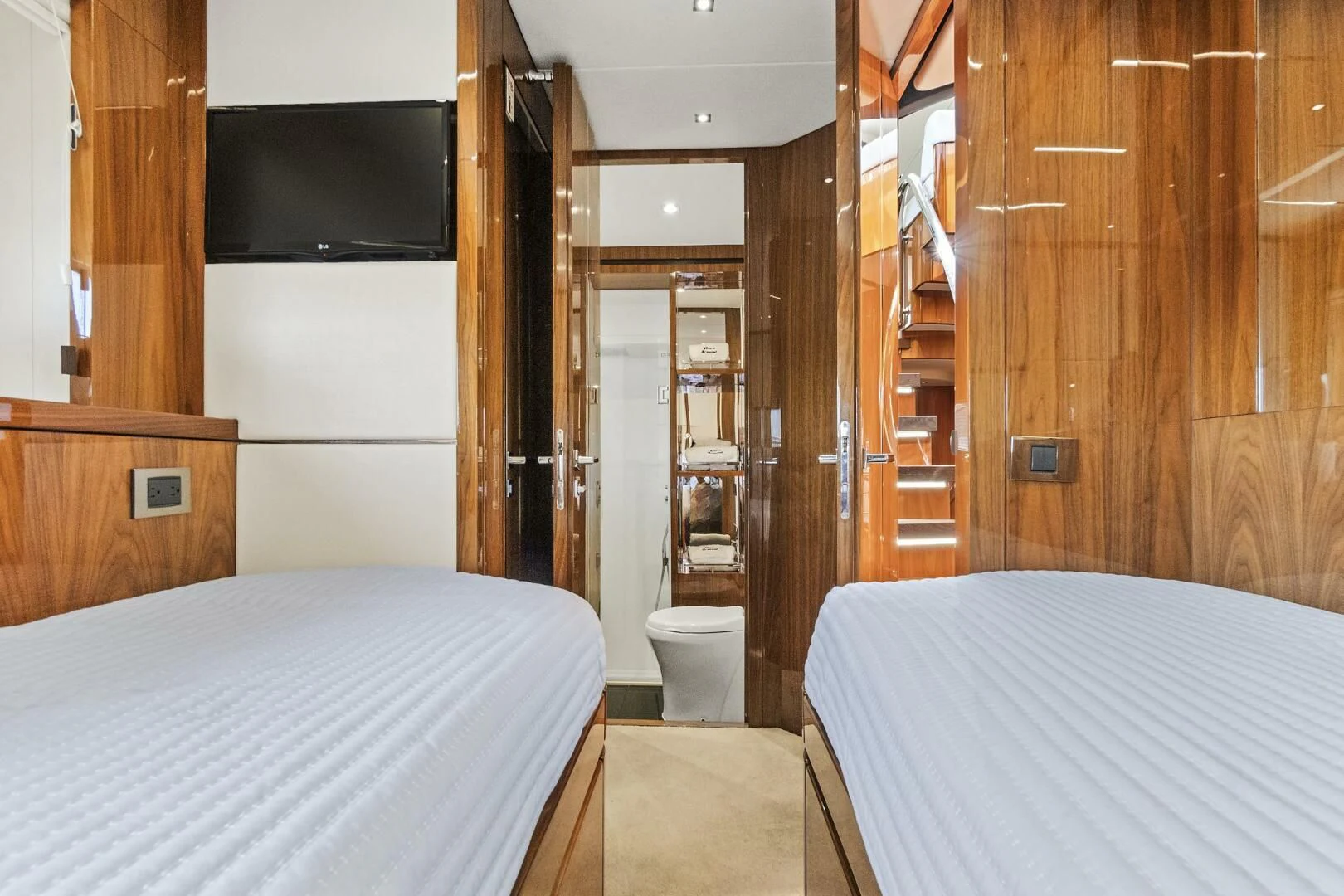 a room with a bed and a television aboard ONCE AROUND Yacht for Sale