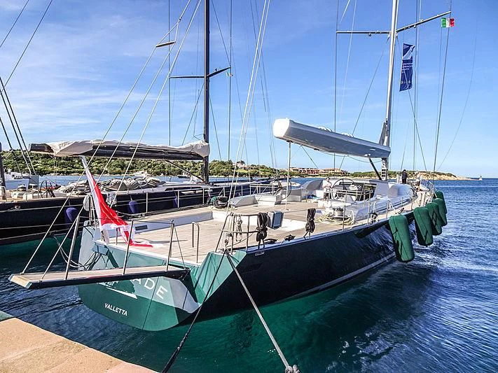 a boat docked at a pier aboard SAUDADE Yacht for Sale