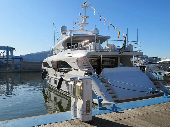 a large boat docked at a pier aboard AZURE DREAMS Yacht for Sale
