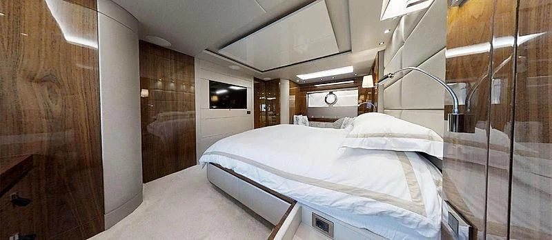 a room with a bed and a mirror aboard RIANNA Yacht for Sale