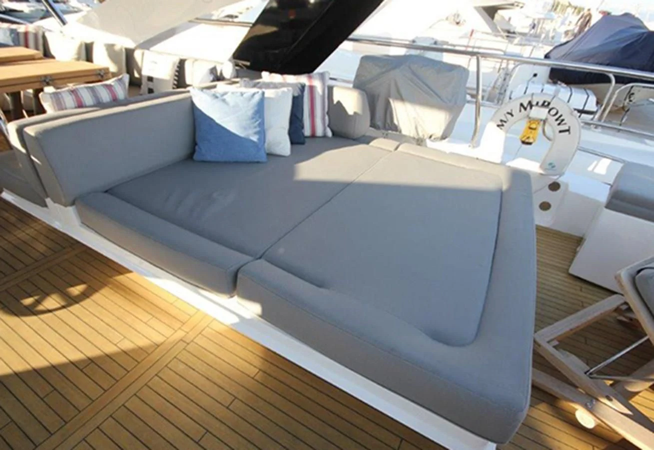 a large grey couch aboard RIANNA Yacht for Sale