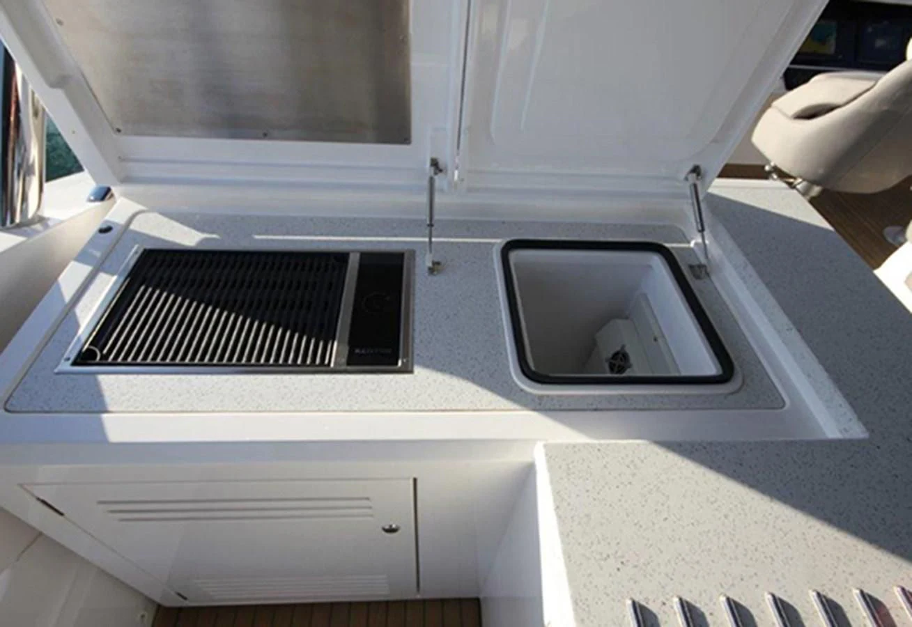 a white car with a black panel aboard RIANNA Yacht for Sale