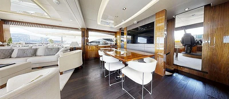 a room with a table and chairs aboard RIANNA Yacht for Sale