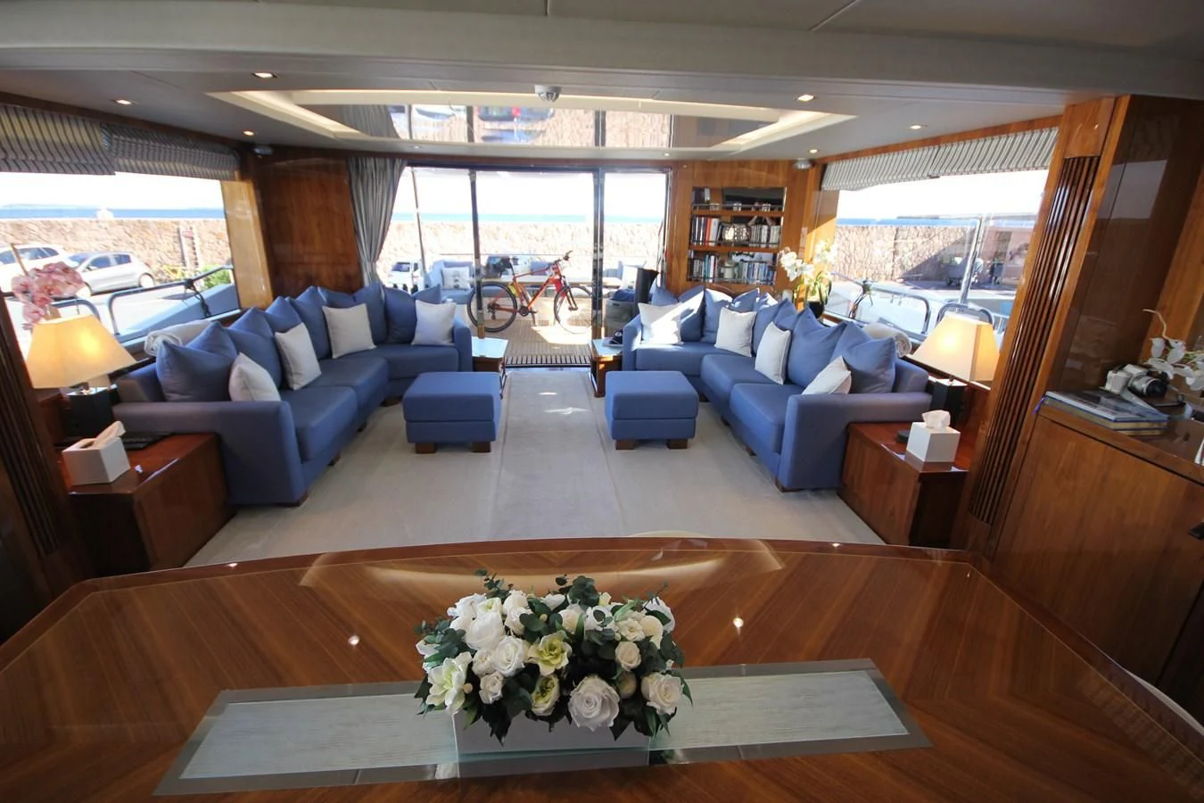 a living room with a large window aboard RIANNA Yacht for Sale