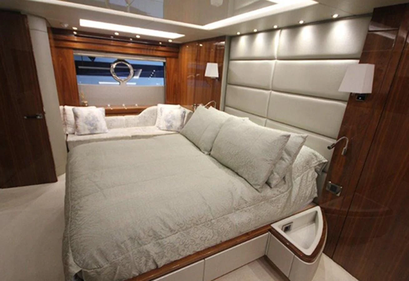 a bed with a mirror above it aboard RIANNA Yacht for Sale