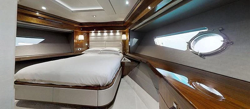 a room with a bed and a window aboard RIANNA Yacht for Sale