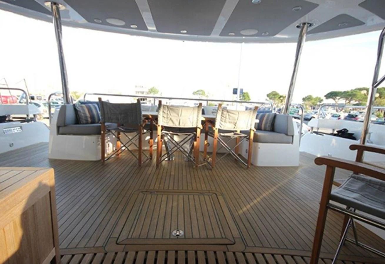 a room with a table and chairs aboard RIANNA Yacht for Sale