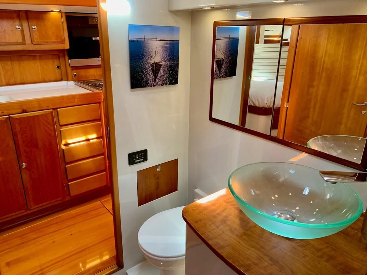 a bathroom with a sink and a toilet aboard HEROINA Yacht for Sale