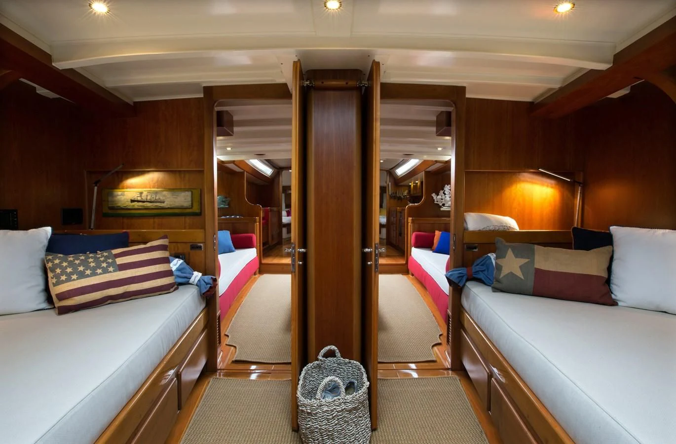 a room with a bed and a mirror aboard HEROINA Yacht for Sale