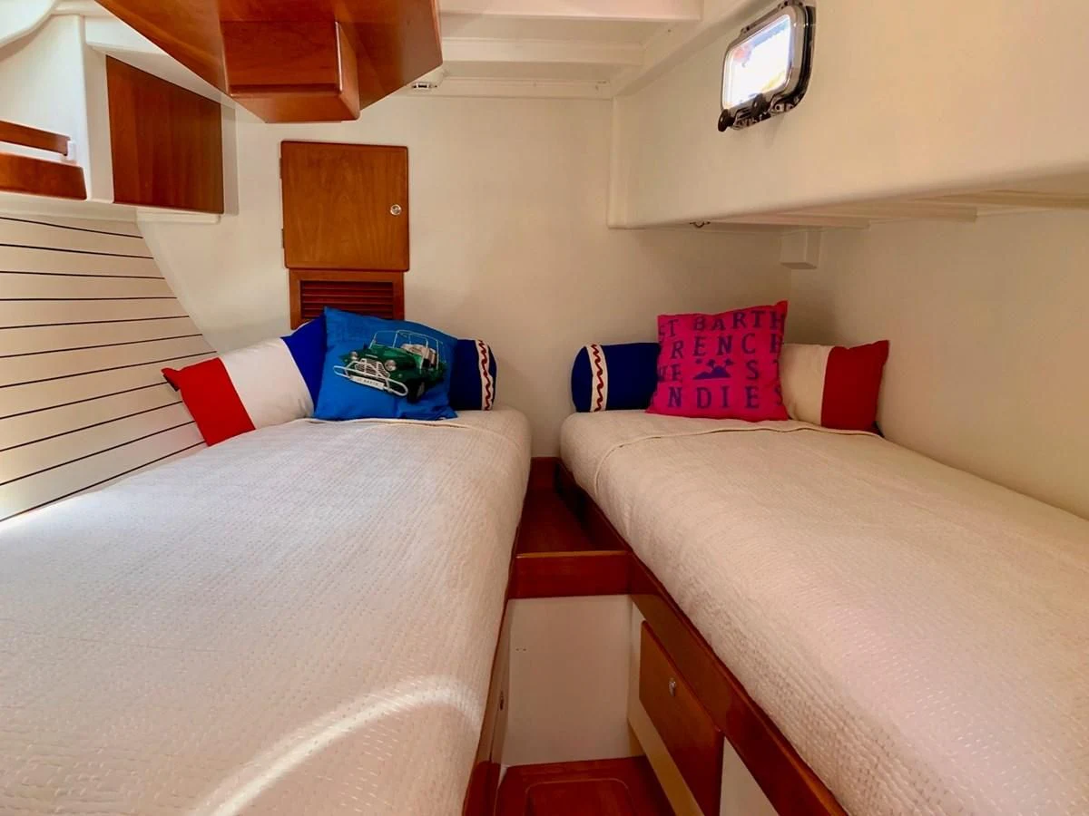a couple of beds in a hotel room aboard HEROINA Yacht for Sale
