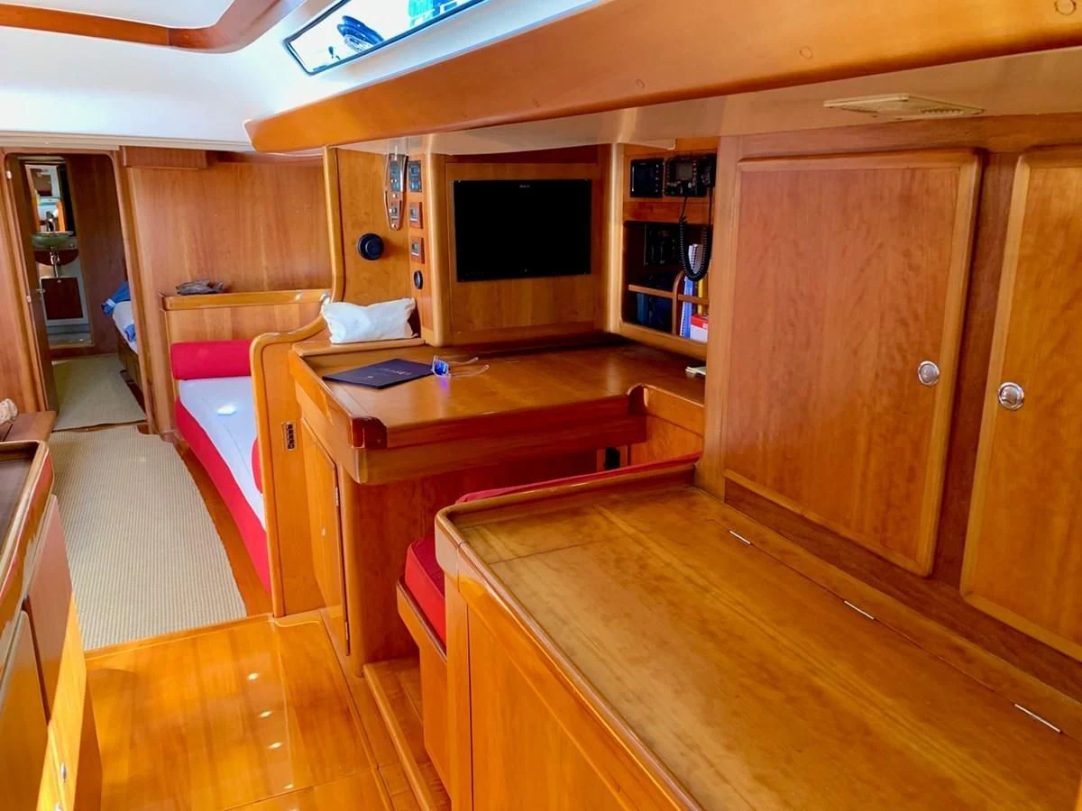 a kitchen with a wood floor aboard HEROINA Yacht for Sale