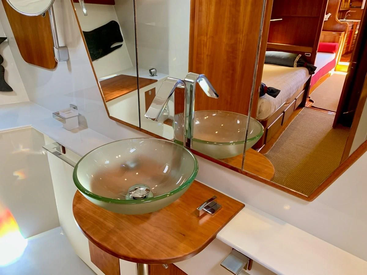 a bathroom with a large round sink aboard HEROINA Yacht for Sale