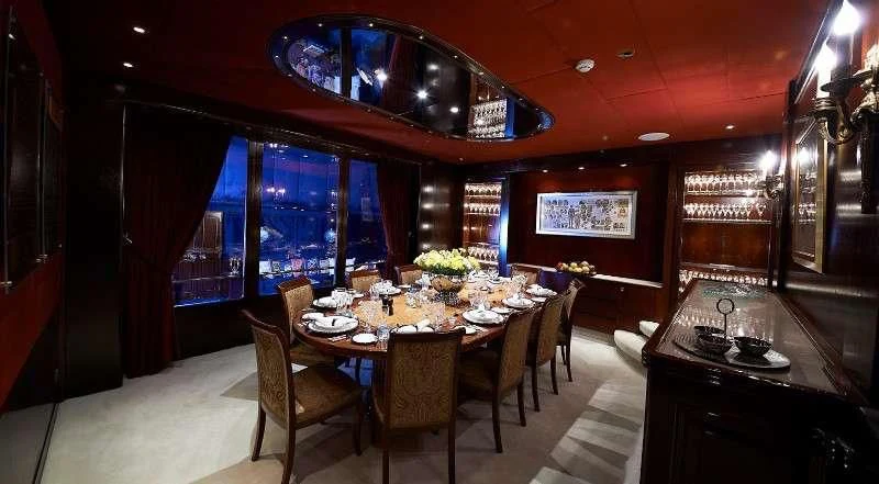 a dining room with a table and chairs aboard THE MERCY BOYS Yacht for Sale