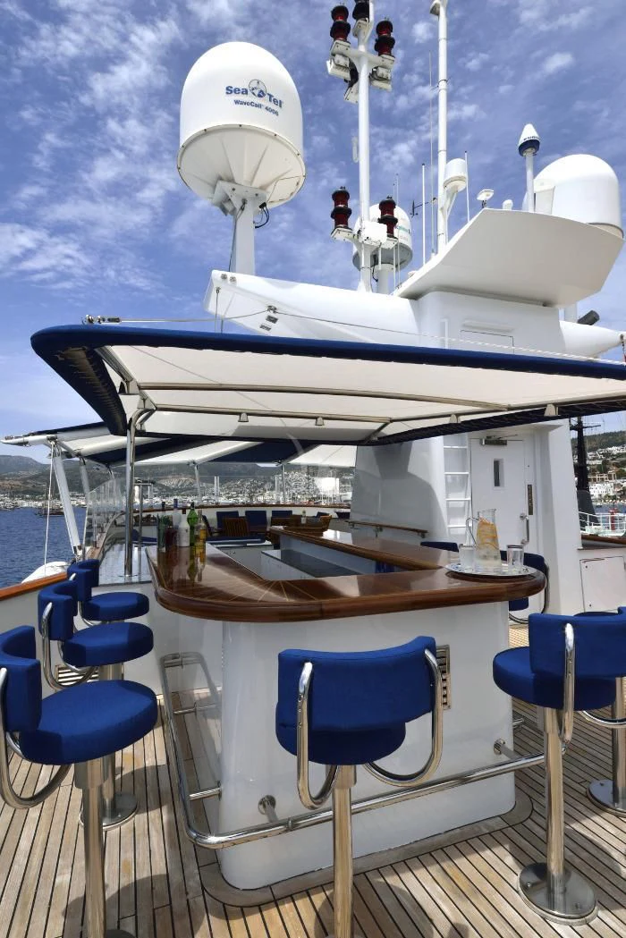 a boat with a table and chairs aboard THE MERCY BOYS Yacht for Sale