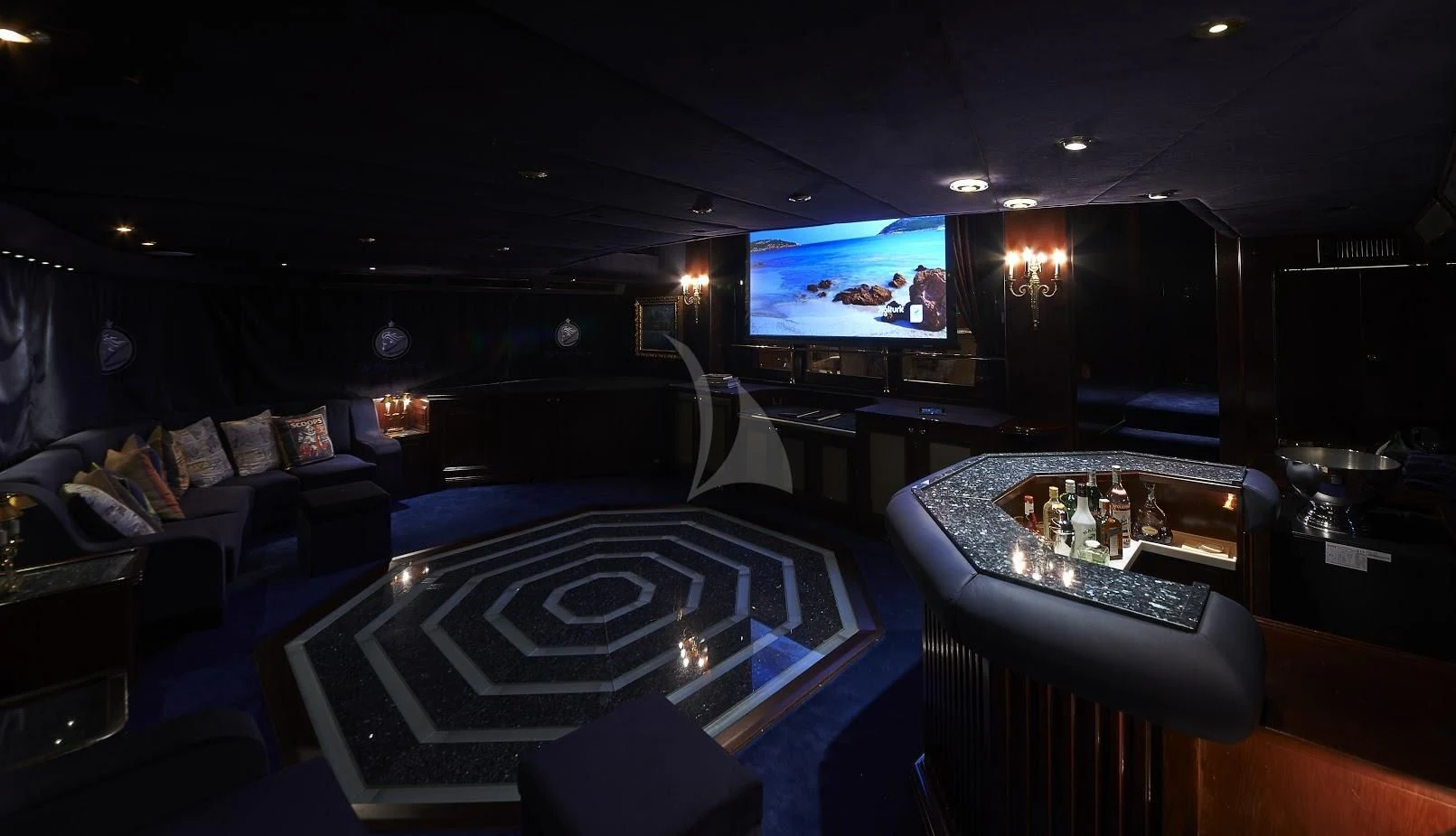 a room with a laptop and a table and a television aboard THE MERCY BOYS Yacht for Sale