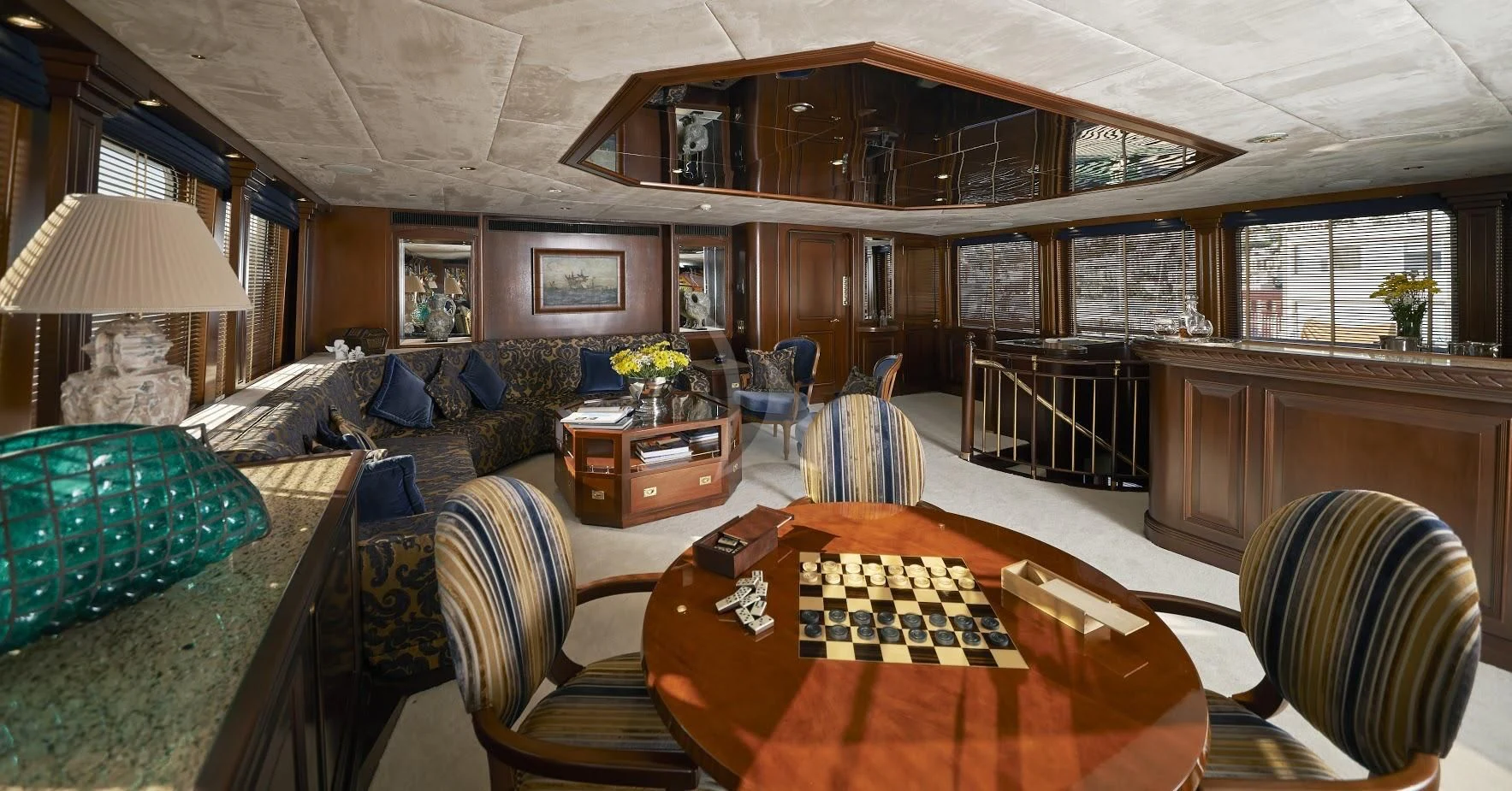 a room with a couch and a table and chairs aboard THE MERCY BOYS Yacht for Sale