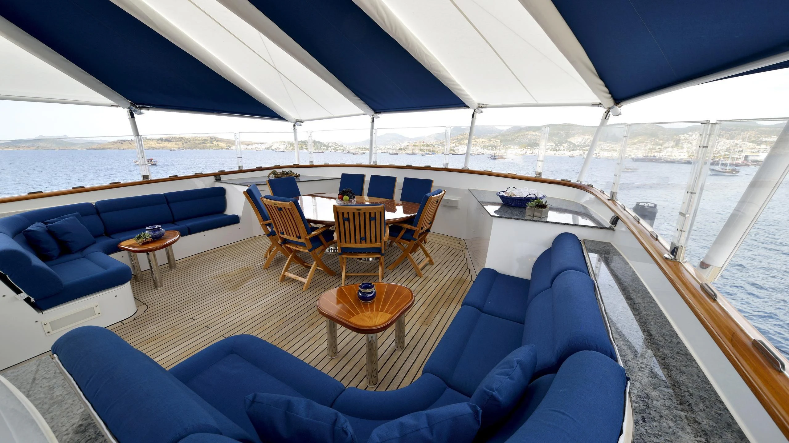a boat with a table and chairs aboard THE MERCY BOYS Yacht for Sale