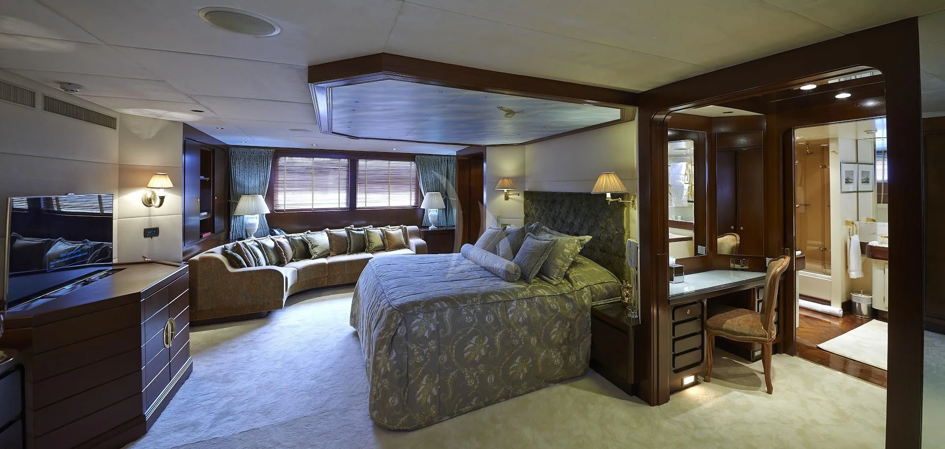 a bedroom with a bed and a desk aboard THE MERCY BOYS Yacht for Sale