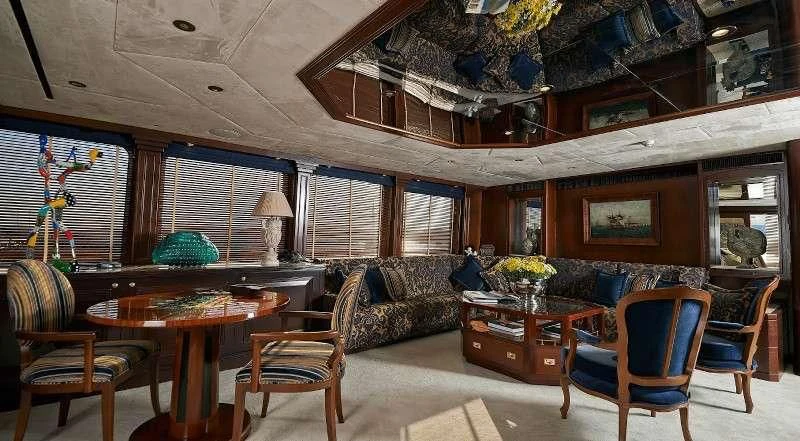 a living room with a large window aboard THE MERCY BOYS Yacht for Sale