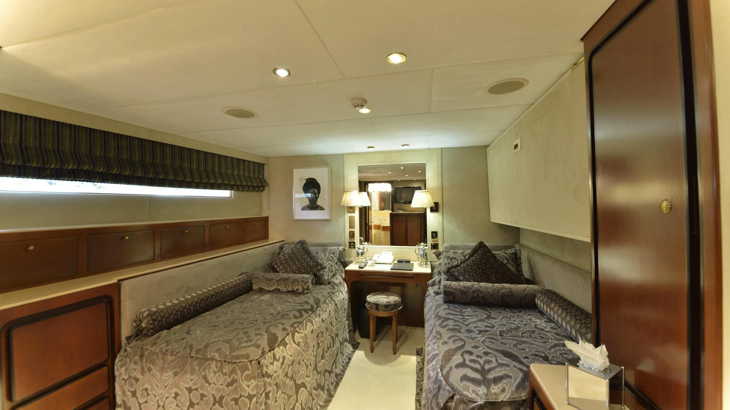 a hotel room with a bed and a desk aboard THE MERCY BOYS Yacht for Sale