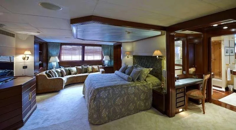 a large bedroom with a bed and a couch aboard THE MERCY BOYS Yacht for Sale