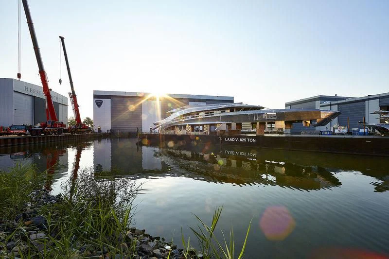 a building with a crane in the background aboard ARKADIA Yacht for Charter