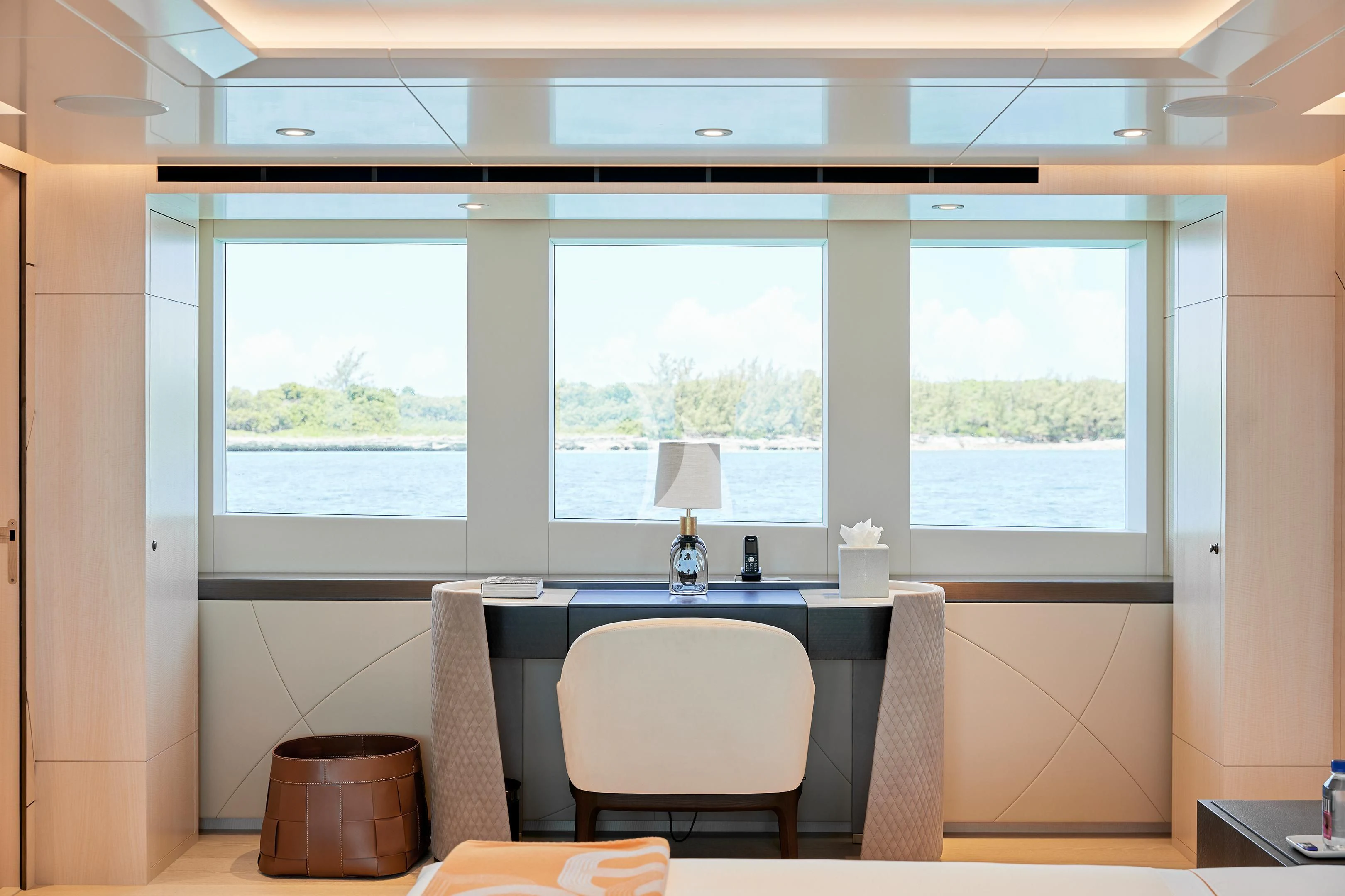 a desk in a room aboard ARKADIA Yacht for Charter