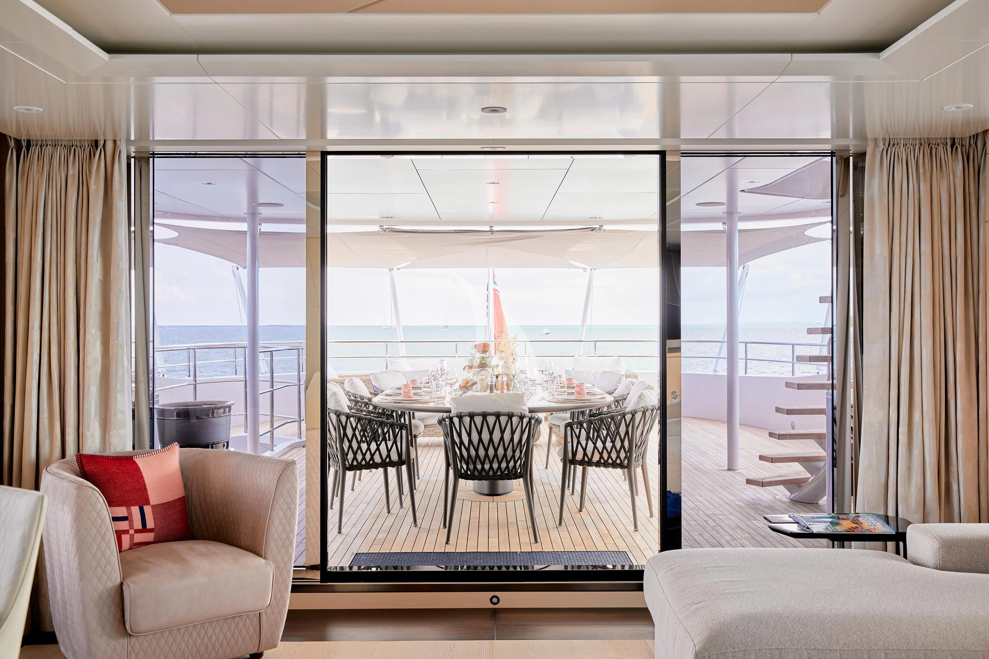 a room with a table and chairs aboard ARKADIA Yacht for Charter