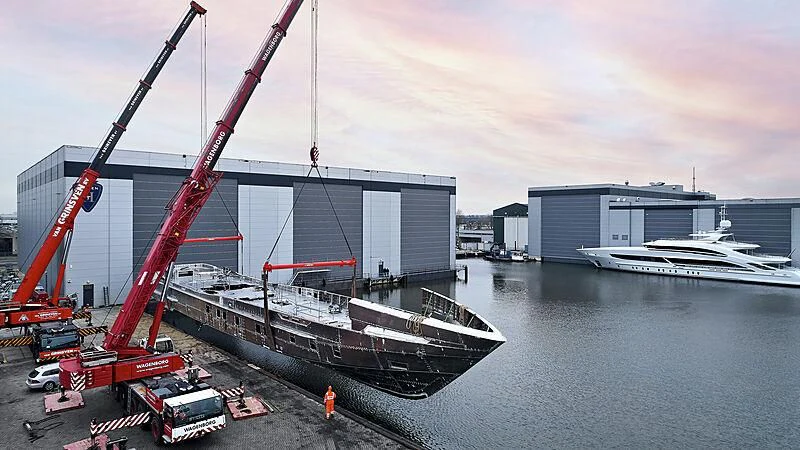 a large crane next to a boat aboard ARKADIA Yacht for Charter