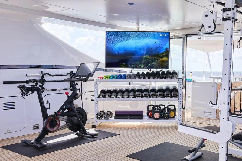 a room with a large screen aboard ARKADIA Yacht for Charter