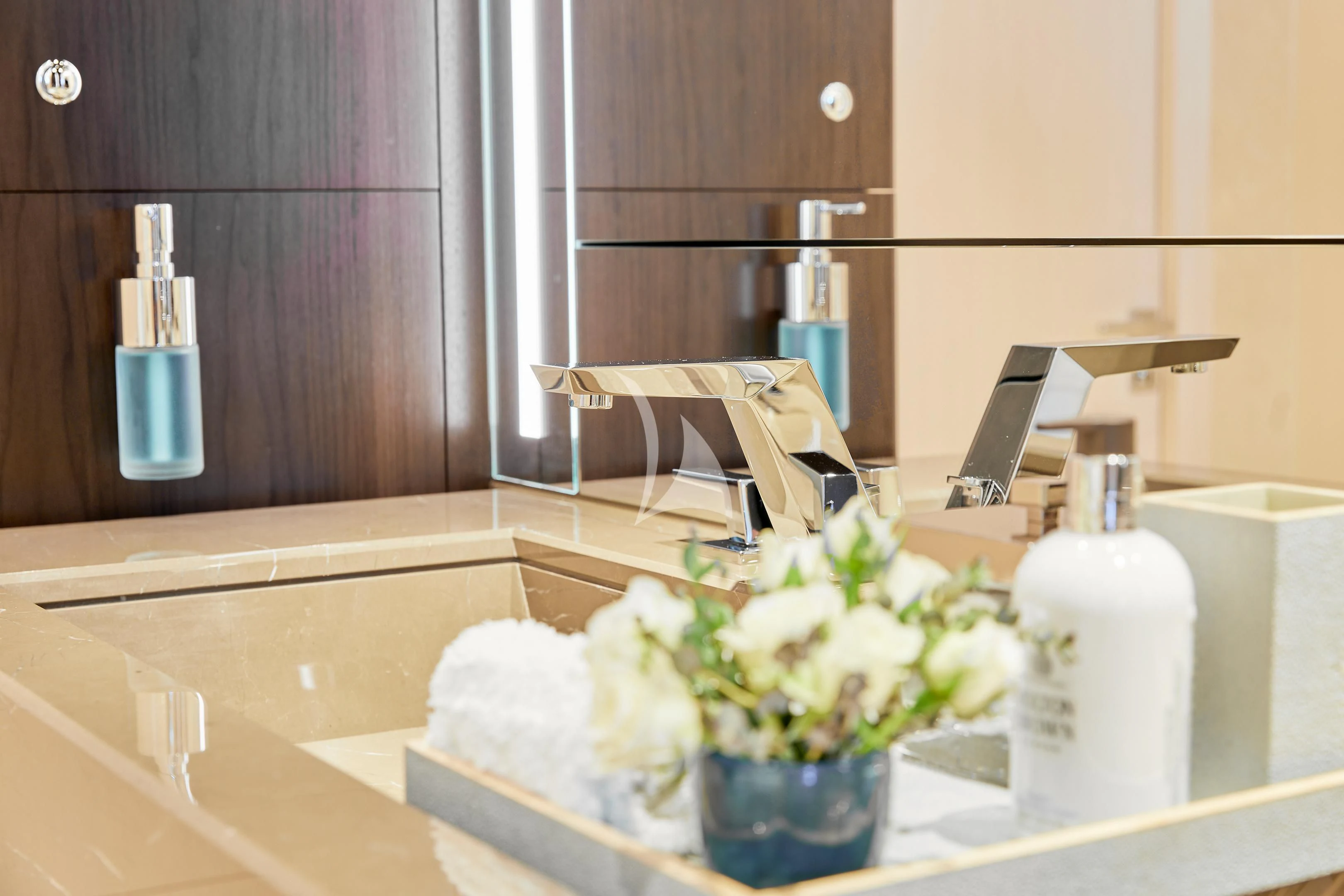 a bathroom with a tub and flowers aboard ARKADIA Yacht for Charter