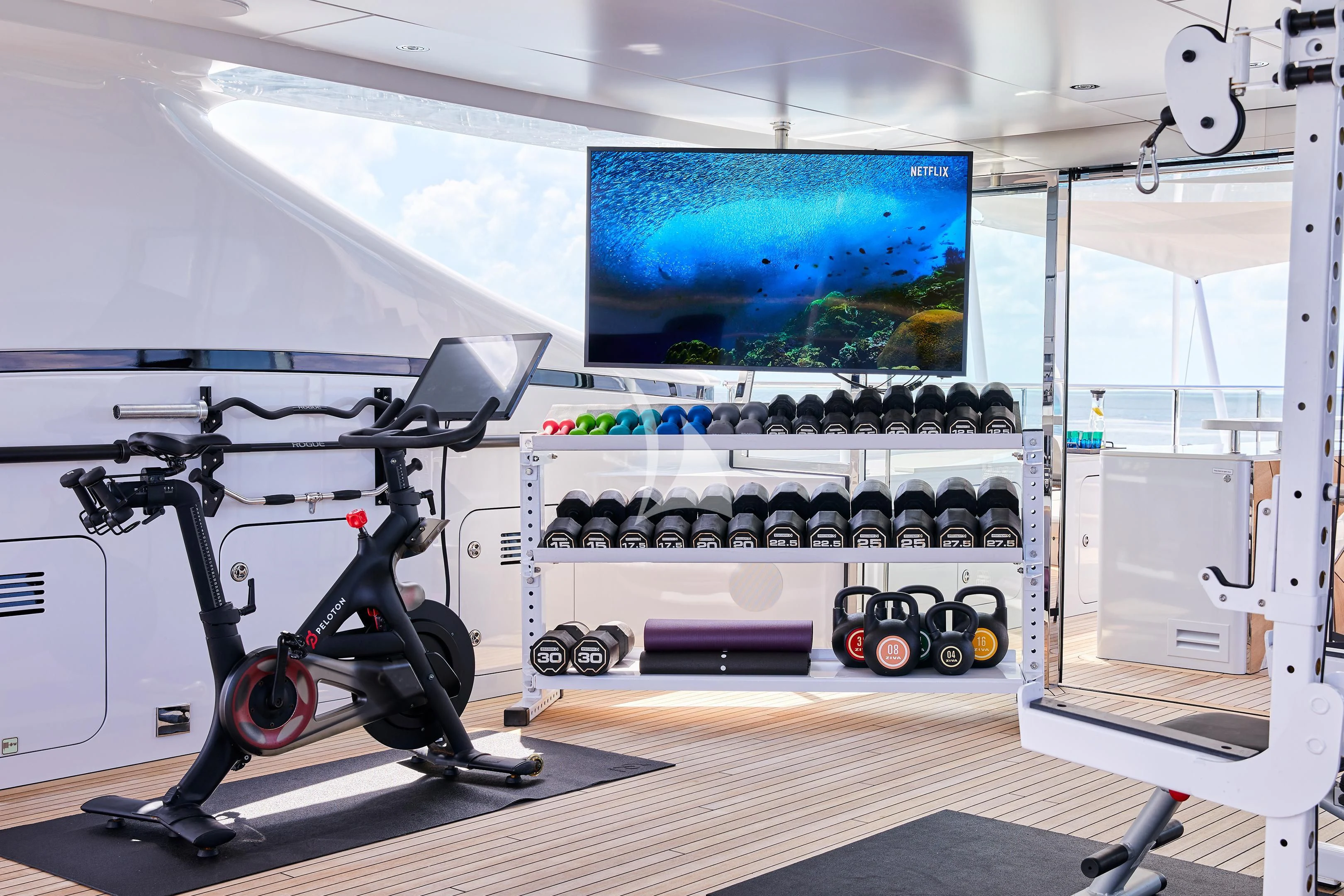 a room with a large screen aboard ARKADIA Yacht for Charter