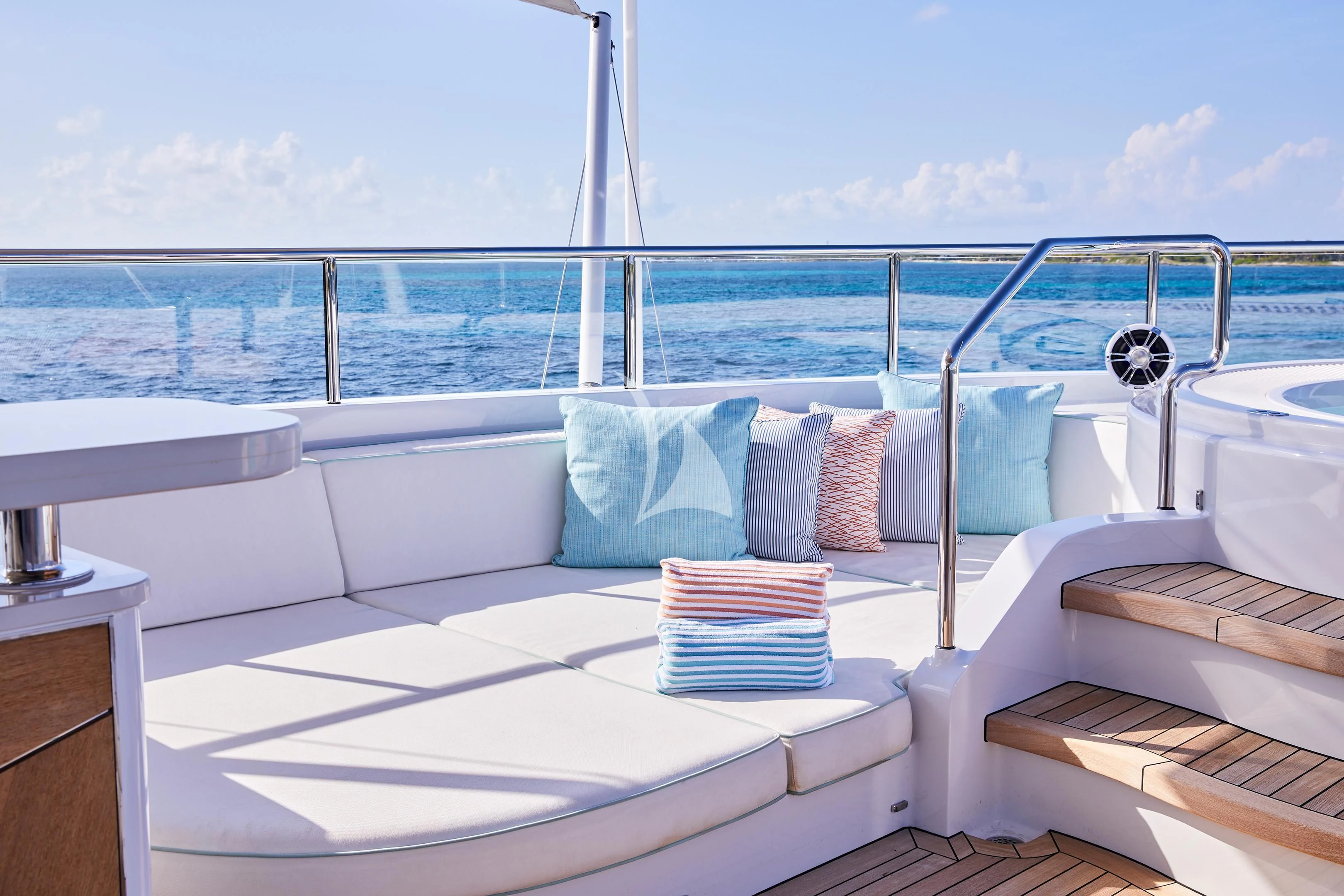 a bed with a white bed spread aboard ARKADIA Yacht for Charter