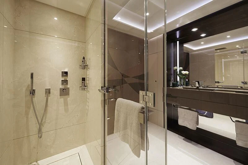 a bathroom with a glass shower aboard ARKADIA Yacht for Charter