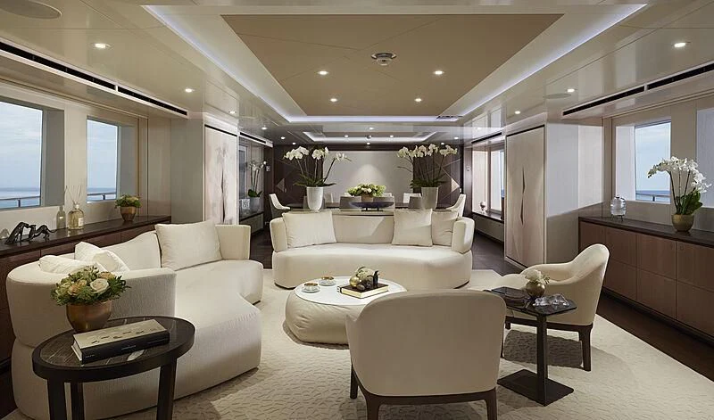a living room with white furniture aboard ARKADIA Yacht for Charter