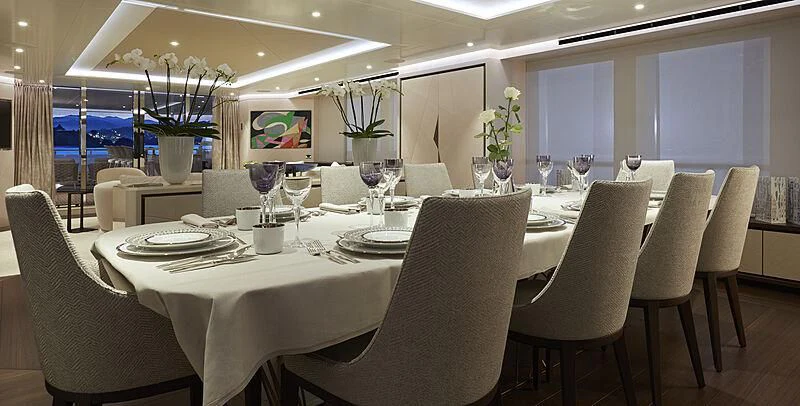 a table set for a dinner aboard ARKADIA Yacht for Charter