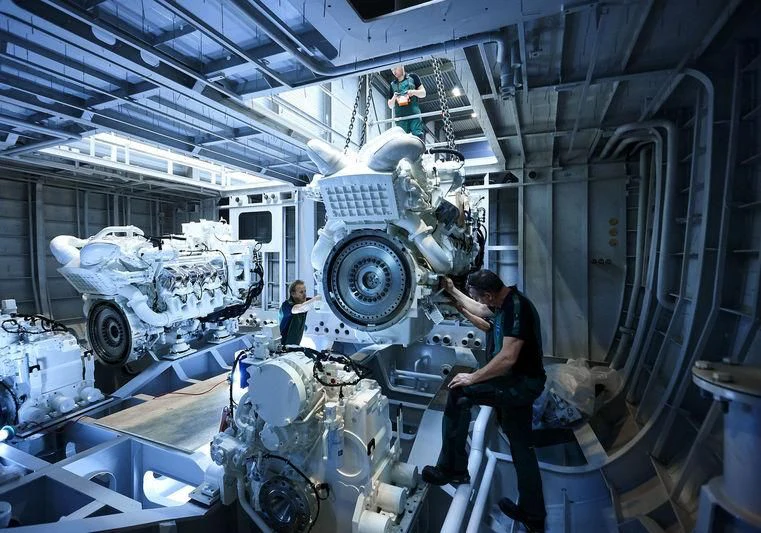 a man working in a factory aboard ARKADIA Yacht for Charter