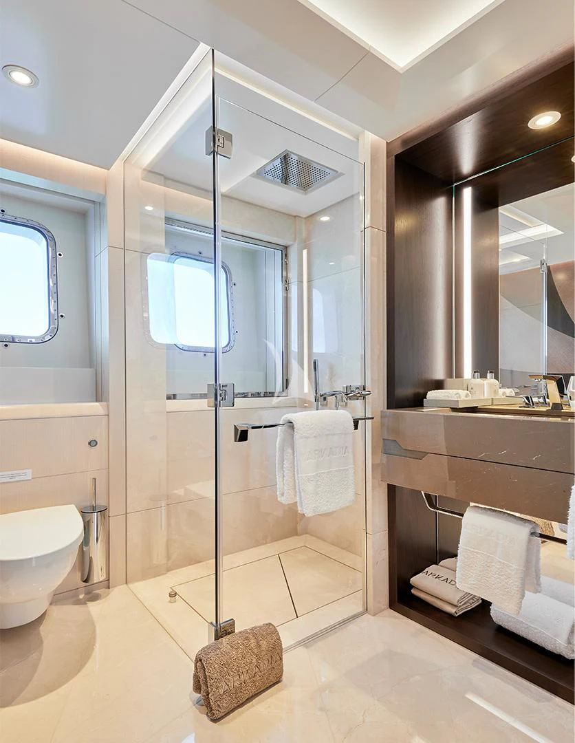 a bathroom with a glass shower aboard ARKADIA Yacht for Charter