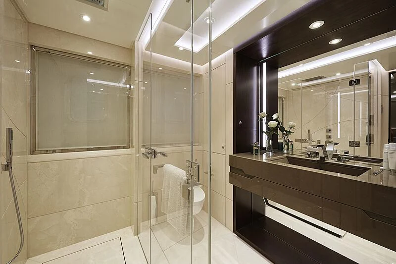 a bathroom with a glass shower aboard ARKADIA Yacht for Charter