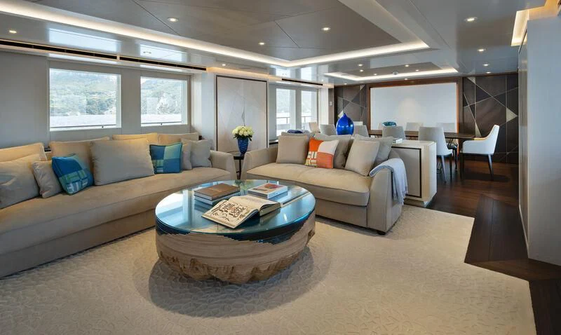 a living room with a couch and a coffee table aboard ARKADIA Yacht for Charter