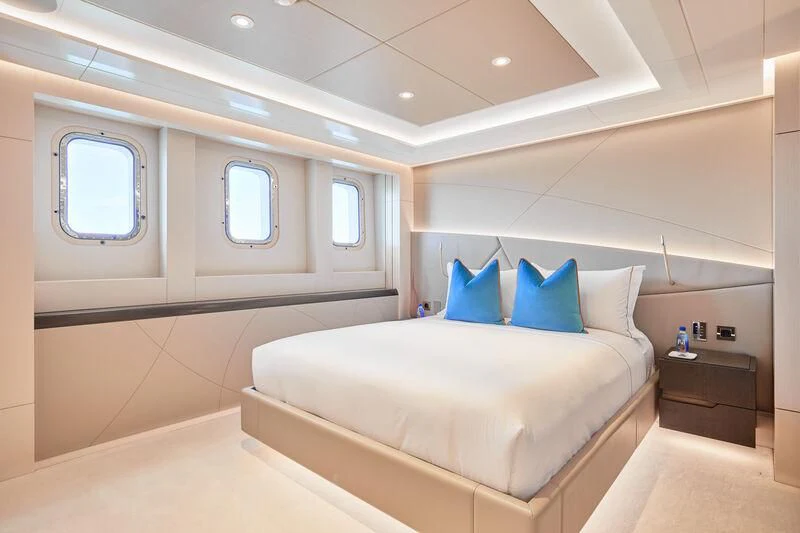 a room with a bed and a window aboard ARKADIA Yacht for Charter