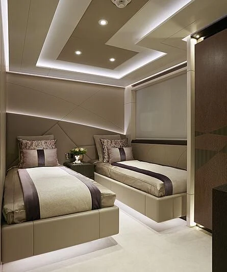 a room with a bed and a couch aboard ARKADIA Yacht for Charter